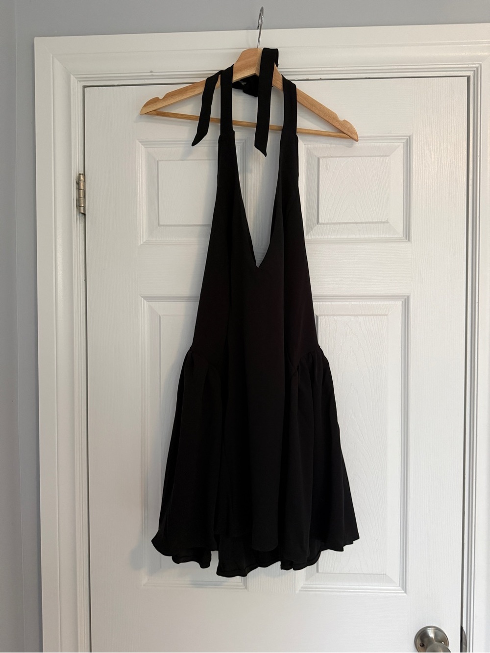 Sleeveless Black Halter Mini Dress with Flowing Skirt